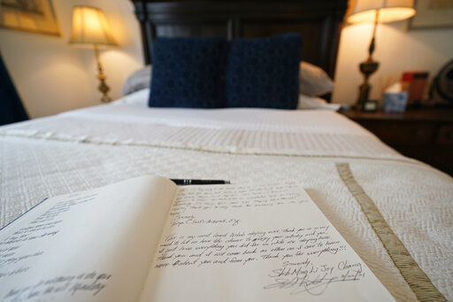 The guest book for the bed-and-breakfast The House of Bise Bespoke rests on a bed, Monday, July 19, 2021, in Cleveland. Small businesses in the U.S. that depend on tourism and vacationers say business is bouncing back, as people re-book postponed trips and take advantage of loosening restrictions, a positive sign for the businesses that have struggled for more than a year. Bise started in 2019 and catered to international tourists, attracting guests from New Zealand, Botswana, Eastern Europe and elsewhere. (AP Photo/Tony Dejak)    PHOTO CREDIT: Tony Dejak