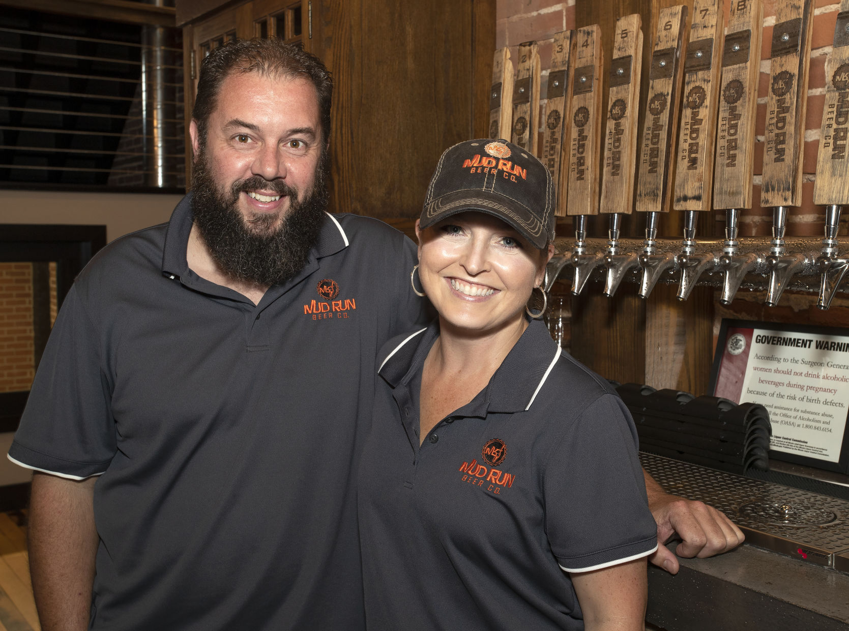 Mud Run Beer Co. owners Kevin and Amanda Pierce appear in their brewpub in downtown Stockton on Thursday. PHOTO CREDIT: Stephen Gassman, Telegraph Herald