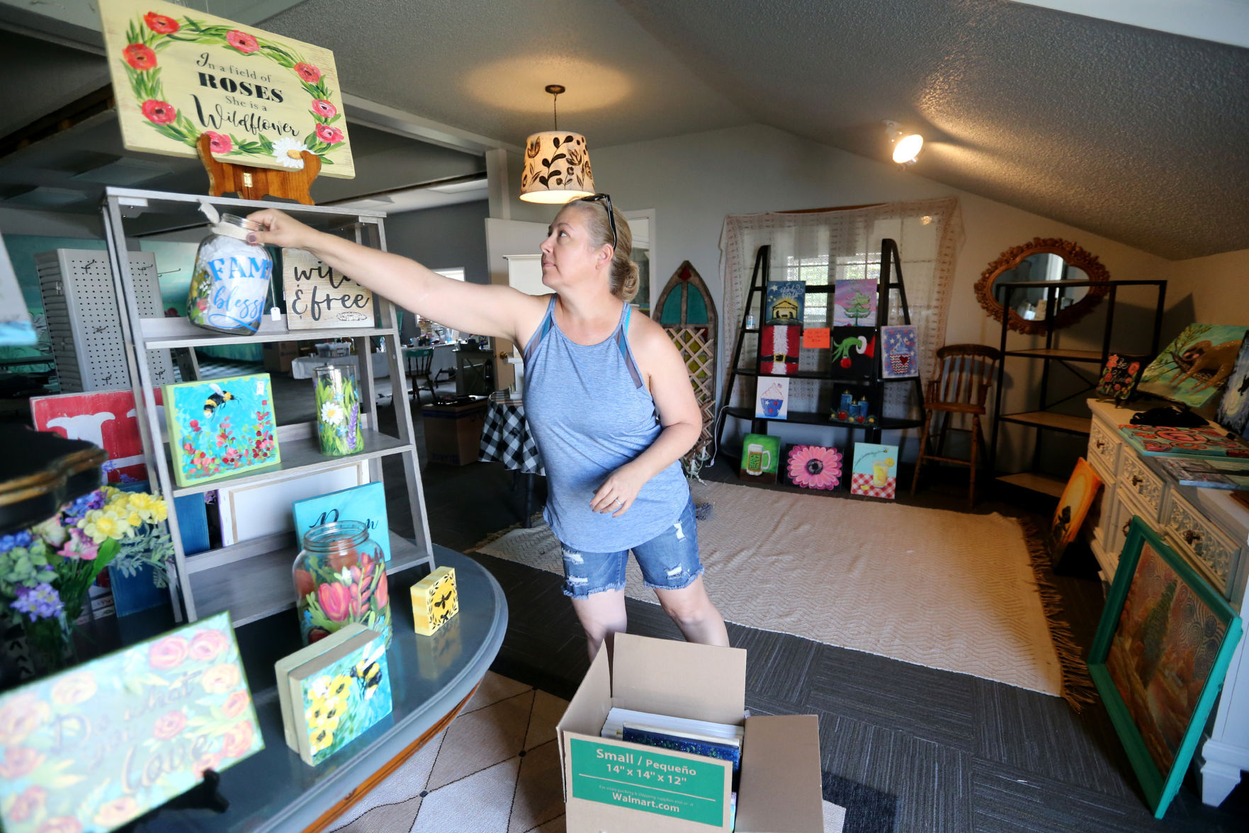 Sarah Barnes packages items at her art studio, Create It, in Dubuque on Monday, July 26, 2021. The location at 1750 Radford Road will close, but the business will remain open.    PHOTO CREDIT: JESSICA REILLY