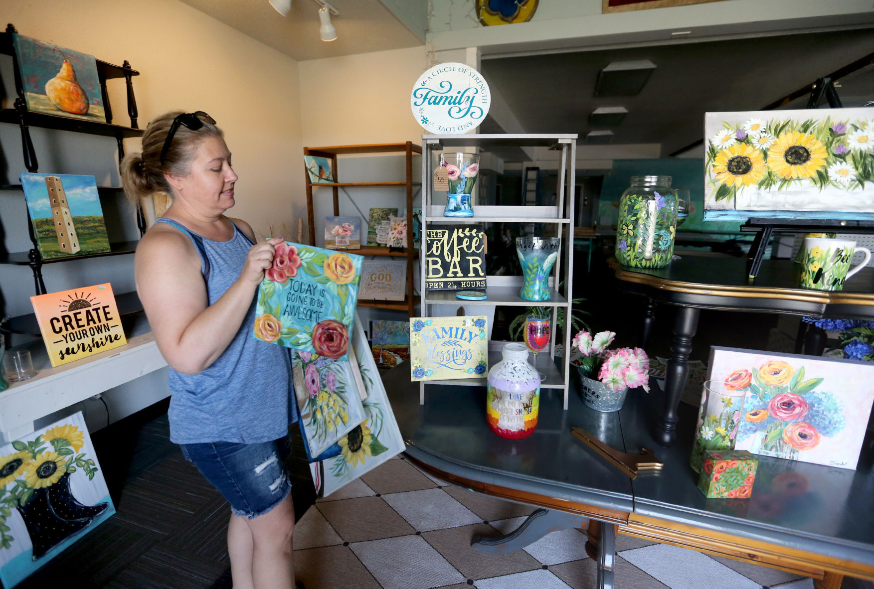 Sarah Barnes packages items at her art studio, Create It, in Dubuque on Monday, July 26, 2021. The location at 1750 Radford Road will close, but the business will remain open.    PHOTO CREDIT: JESSICA REILLY