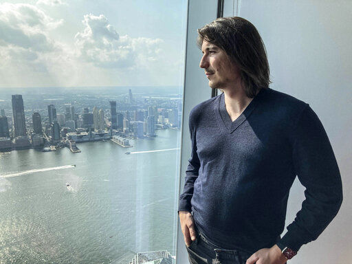 Robinhood CEO Vlad Tenev poses for a picture during an interview about the company that introduced a new generation of investors into the stock market and forced the industry to stop charging fees for trading, Wednesday, July 28, 2021, in New York. Shares of Robinhood Markets are set to begin trading on the Nasdaq for the first time Thursday. (AP Photo/David R. Martin)    PHOTO CREDIT: David R. Martin
