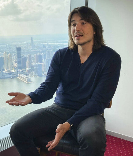 Robinhood CEO Vlad Tenev speaks during an interview about the company that introduced a new generation of investors into the stock market and forced the industry to stop charging fees for trading, Wednesday, July 28, 2021, in New York. Shares of Robinhood Markets are set to begin trading on the Nasdaq for the first time Thursday. (AP Photo/David R. Martin)    PHOTO CREDIT: David R. Martin