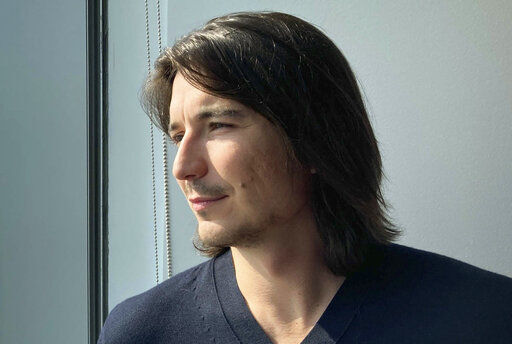 Robinhood CEO Vlad Tenev poses for a picture during an interview about the company that introduced a new generation of investors into the stock market and forced the industry to stop charging fees for trading, Wednesday, July 28, 2021, in New York. Shares of Robinhood Markets are set to begin trading on the Nasdaq for the first time Thursday. (AP Photo/David R. Martin)    PHOTO CREDIT: David R. Martin