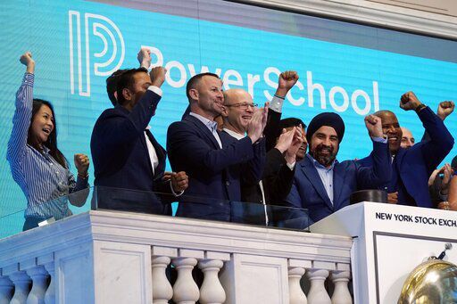 PowerSchool CEO Hardeep Gulati, second from right, rings the New York Stock Exchange opening bell, celebrating his company