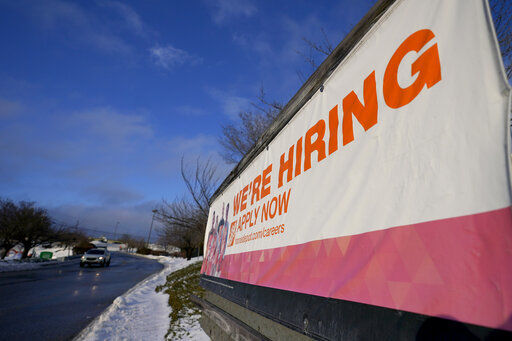 A sign announcing hiring is seen in the parking lot of a Home Depot, Monday, Feb. 22, 2021, in Cockeysville, Md. The number of Americans collecting unemployment benefits slid last week, another sign that the job market continues to recover rapidly from the coronavirus recession. Jobless claims dropped by 24,000 to 400,000 last week, the Labor Department reported Thursday, July 29, 2021. (AP Photo/Julio Cortez)    PHOTO CREDIT: Julio Cortez