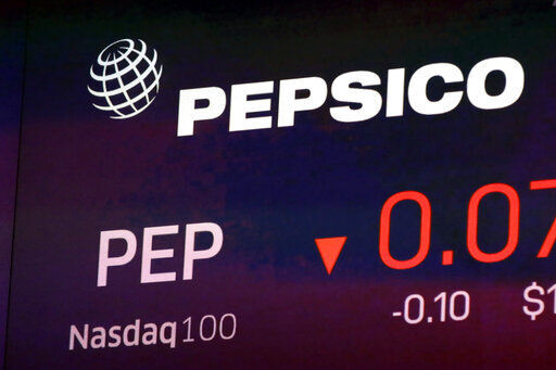 FILE - The symbol for Pepsico appears on a screen at the Nasdaq MarketSite in New York, in this Tuesday Oct. 1, 2019, file photo. PepsiCo will sell Tropicana and other juices to a private equity firm in exchange for pretax proceeds of $3.3 billion. PepsiCo will have a 39% non-controlling stake in a newly formed joint venture in the deal with PAI Partners .(AP Photo/Richard Drew, File)    PHOTO CREDIT: Richard Drew