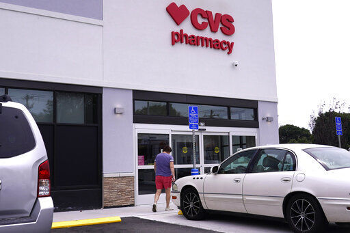  Customers returned to CVS Health stores to fill prescriptions and get COVID-19 tests and vaccines, helping to push the health care giant past Wall Street’s second-quarter expectations.    PHOTO CREDIT: Charles Krupa