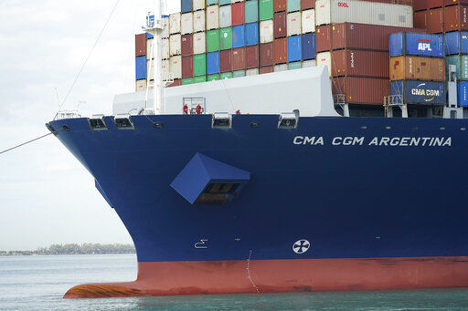 In this April 6, 2021 photo, crew members stand on the bow as the CMA CGM Argentina arrives at PortMiami, the largest container ship to call at a Florida port in Miami. Importers are contending with a perfect storm of supply trouble — rising prices, overwhelmed ports, a shortage of ships, trains, trucks — that is expected to last into 2022. (AP Photo/Lynne Sladky)    PHOTO CREDIT: Lynne Sladky