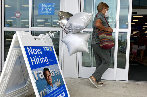 A shopper passes a hiring sign while entering a retail store in Morton Grove, Ill., Wednesday, July 21, 2021. Despite an uptick in COVID-19 cases and a shortage of available workers, the U.S. economy likely enjoyed a burst of job growth last month as it bounces back with surprising vigor from last year’s coronavirus shutdown. The Labor Department’s July jobs report Friday, Aug. 6 is expected to show that the United States added more than 860,000 jobs in July, topping June’s 850,000, according to a survey of economists by the data firm FactSet. (AP Photo/Nam Y. Huh)    PHOTO CREDIT: Nam Y. Huh