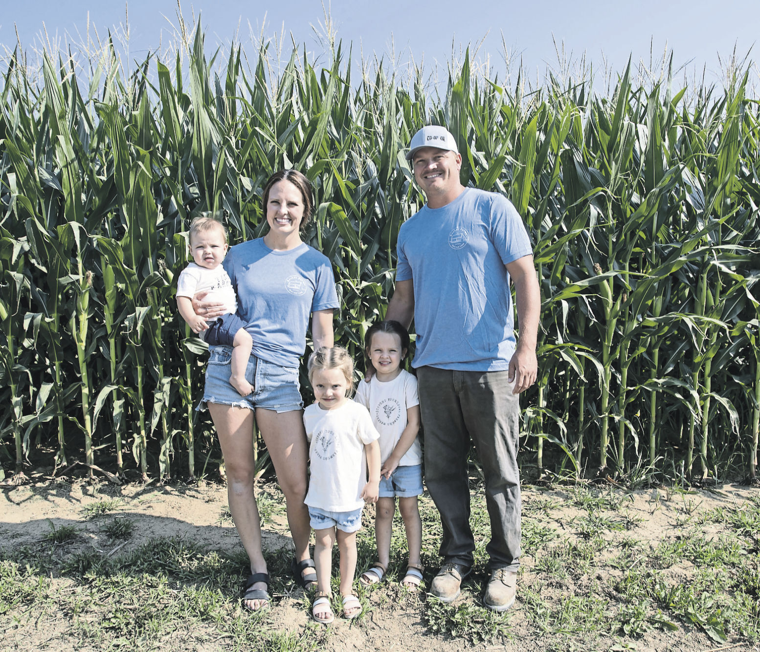 The Recker family -- Ford, 8 months old (left); Cara; Wynnie, 3; Willow, 4; and Joe -- on their farm in rural Dyersville, Iowa.    PHOTO CREDIT: Stephen Gassman, Telegraph Herald