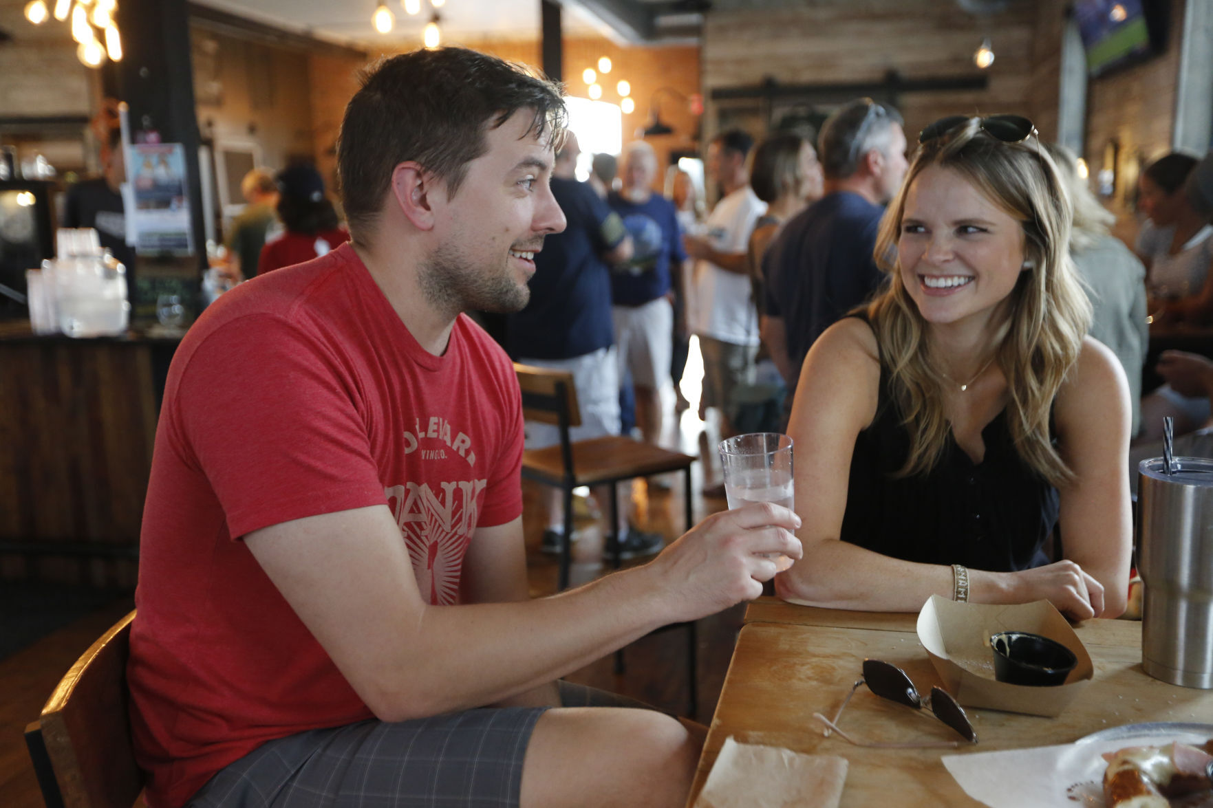 Dave and Diana Ackerman, of Bloomington, Minn., enjoy some food and drinks at Textile Brewing Company on Wednesday in Dyersville, Iowa.    PHOTO CREDIT: Paul Kurutsides