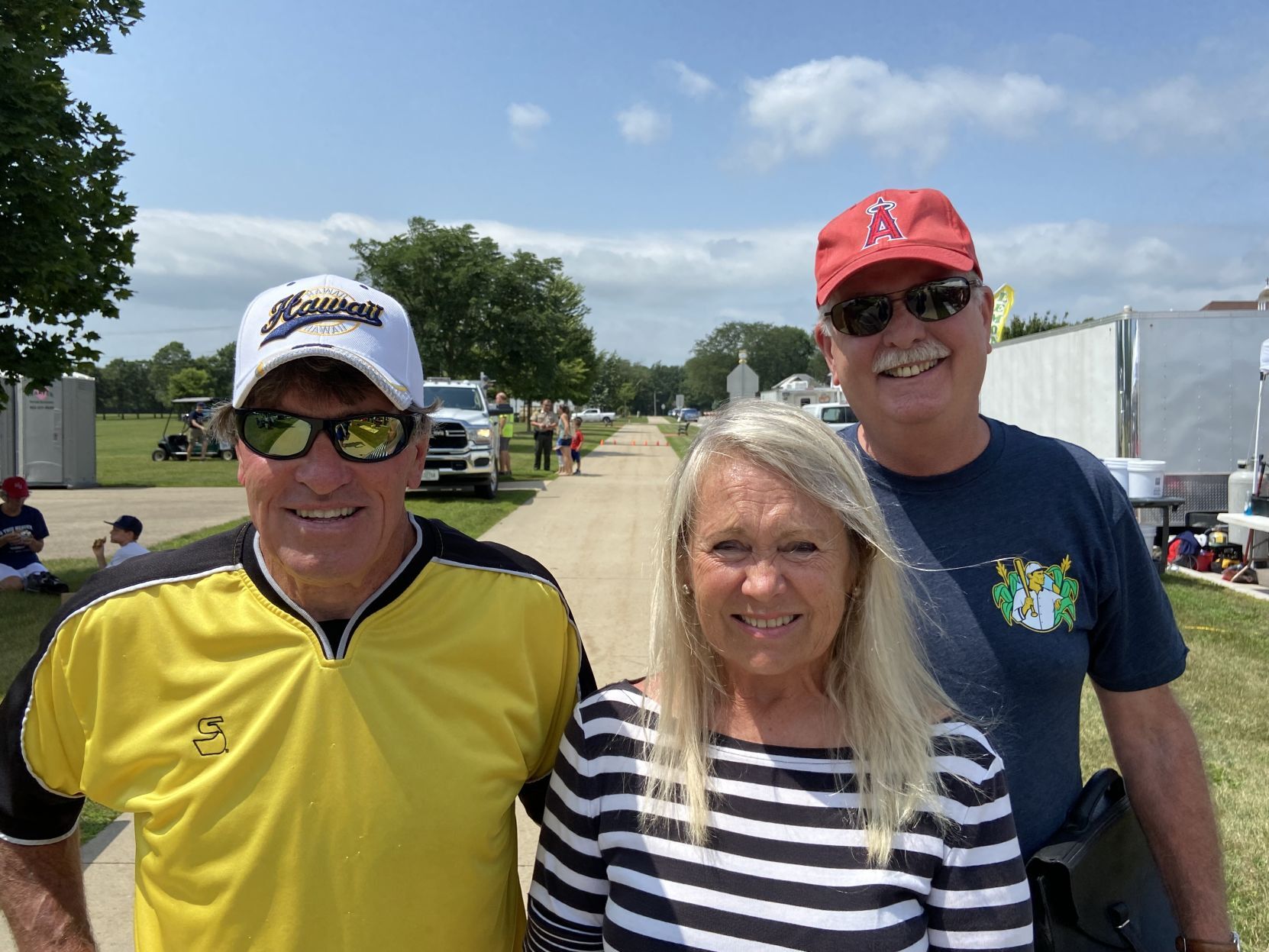Mike Staudt and Cindy Staudt, both of Waterloo, Iowa, and Dave Lee (right), of Mission Viejo, Calif., attend Beyond the Game festivities on Wednesday in Dyersville, Iowa. 