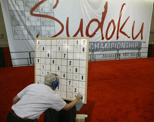 Ronald Osher, of Stamford Conn., works on his puzzle in the final round during the Philadelphia Inquirer Sudoku National Championship in 2007 in Philadelphia. Maki Kaji, known as the “Godfather of Sudoku,” for the numbers puzzle he created, has died. He was 69.    PHOTO CREDIT: Joseph Kaczmarek