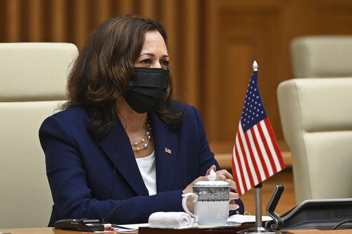 U.S. Vice President Kamala Harris attends a meeting with Vietnamese Prime Minister Pham Minh Chinh at the government office in Hanoi, Vietnam, Wednesday, Aug. 25, 2021. Harris turns her focus to the coronavirus pandemic and global health during her visit to Vietnam, a country grappling with a worsening surge in the virus and stubbornly low vaccination rates. (Manan Vatsyayana/Pool Photo via AP)    PHOTO CREDIT: Manan Vatsyayana