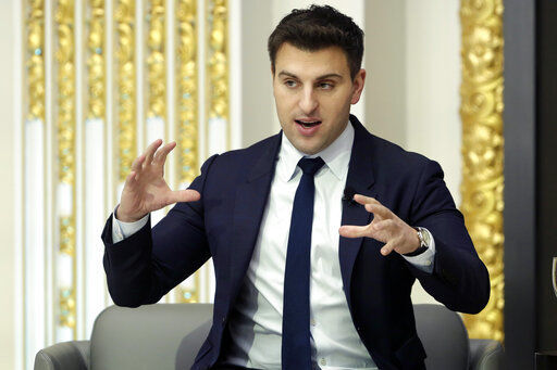 FILE - In this Monday, March 13, 2017, file photo, Airbnb co-founder and CEO Brian Chesky is interviewed during a luncheon meeting of the Economic Club of New York. The CEO of Airbnb says that the home-sharing company will start offering free housing to 20,000 Afghan refugees globally on Tuesday, Aug. 24, 2021. “The displacement and resettlement of Afghan refugees in the U.S. and elsewhere is one of the biggest humanitarian crises of our time. We feel a responsibility to step up," Brian Chesky wrote on Twitter. (AP Photo/Richard Drew, FIle)    PHOTO CREDIT: Richard Drew