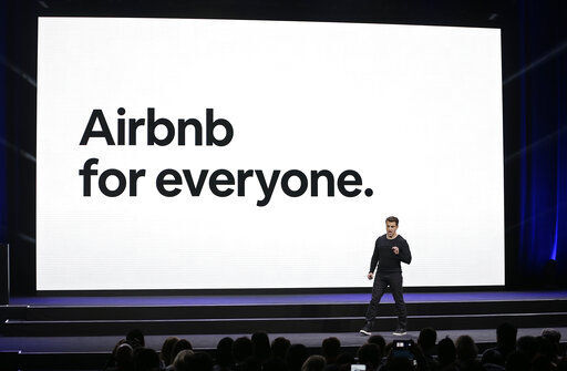 FILE - Airbnb co-founder and CEO Brian Chesky speaks during an event in San Francisco, in this Thursday, Feb. 22, 2018, file photo. The CEO of Airbnb says that the home-sharing company will start offering free housing to 20,000 Afghan refugees globally on Tuesday, Aug. 24, 2021. “The displacement and resettlement of Afghan refugees in the U.S. and elsewhere is one of the biggest humanitarian crises of our time. We feel a responsibility to step up," Brian Chesky wrote on Twitter. (AP Photo/Eric Risberg, FIle)    PHOTO CREDIT: Eric Risberg
