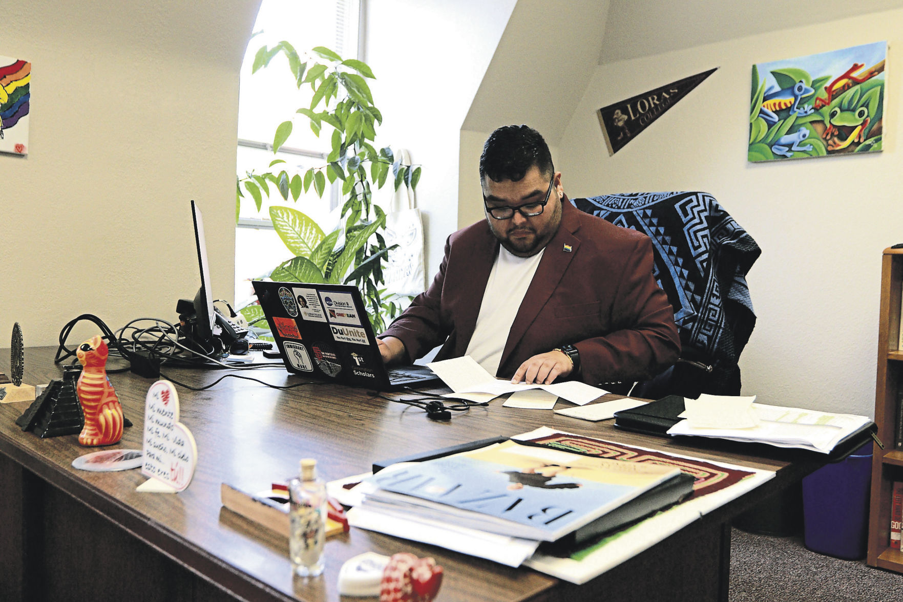 Sergio Perez works in his office at Loras College.    PHOTO CREDIT: Katie Goodale/Telegraph Herald