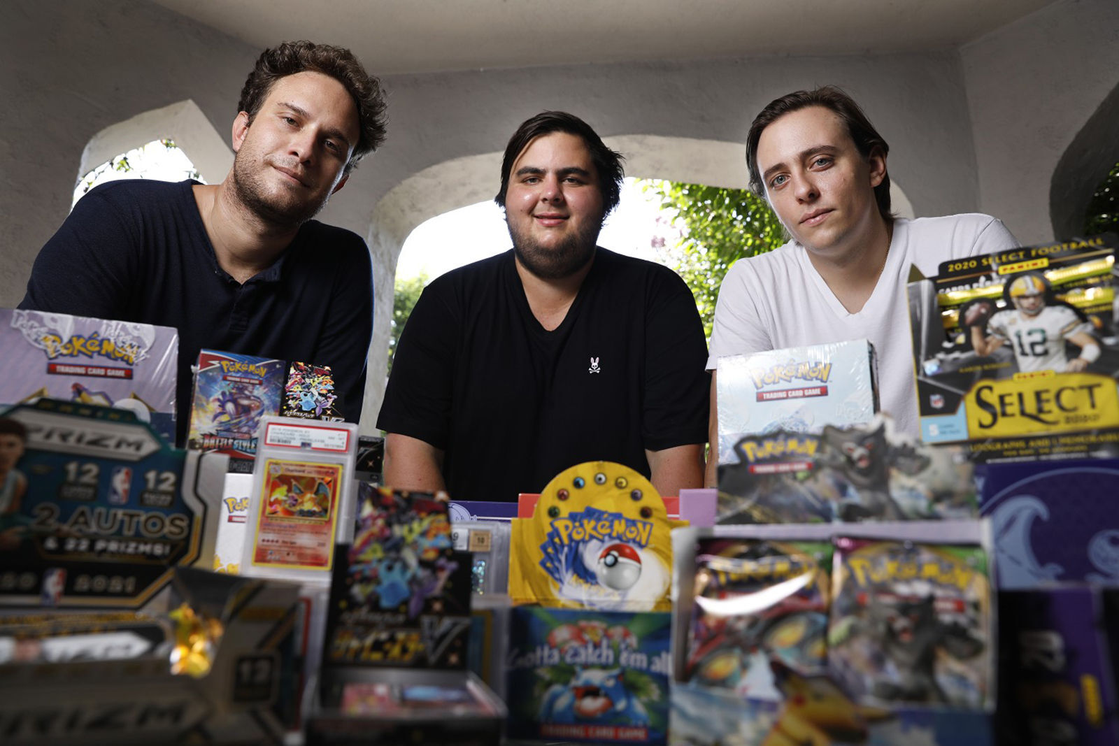 Anthony Jimenez, Michael Hotchkiss, and Gio Mancuso, from left, who run a live Instagram show selling and buying Pokemon collectibles, are photographed in Los Angeles.    PHOTO CREDIT: Tribune News Service
