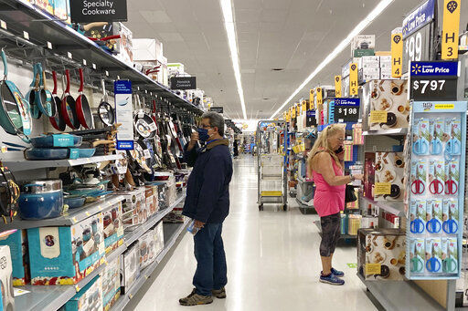 Consumers shop at a Walmart store in Vernon Hills, Ill., Sunday, May 23, 2021. U.S. consumer confidence fell in August to the lowest level since February amid rising concerns about the rapidly spreading delta variant of the coronavirus and worries about higher inflation.     PHOTO CREDIT: Nam Y. Huh