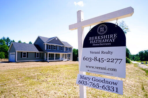 A real estate sign is posted in front of a newly constructed single family home in Auburn, N.H. U.S. home prices jumped by a record amount in June as homebuyers competed for a limited supply of available houses, the latest evidence that the housing market remains red-hot.     PHOTO CREDIT: Charles Krupa