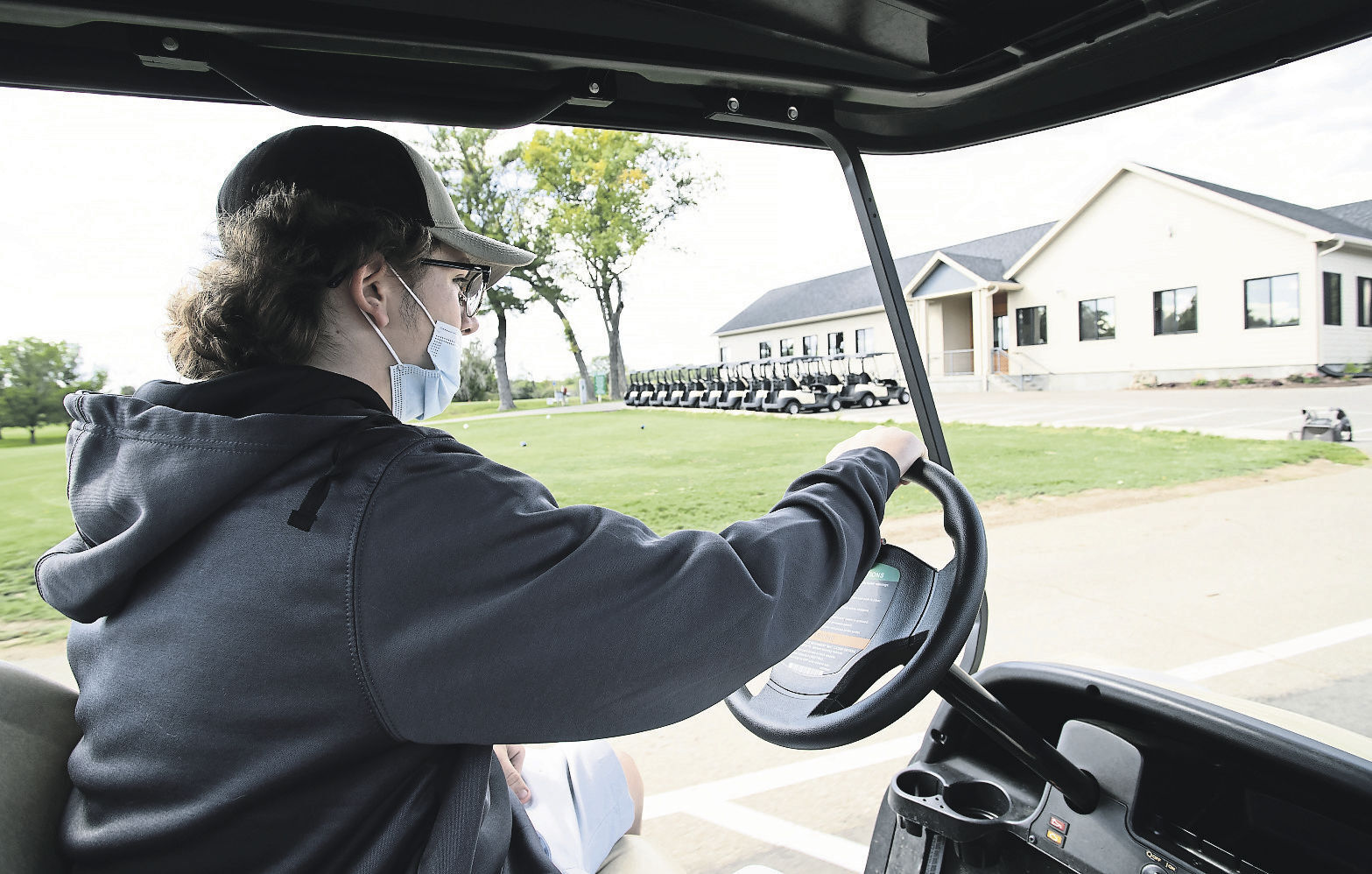 Zak McElmeel, a student at Dubuque Senior, stages carts at Lacoma Golf Course in East Dubuque, Ill., on Wednesday.    PHOTO CREDIT: Stephen Gassman