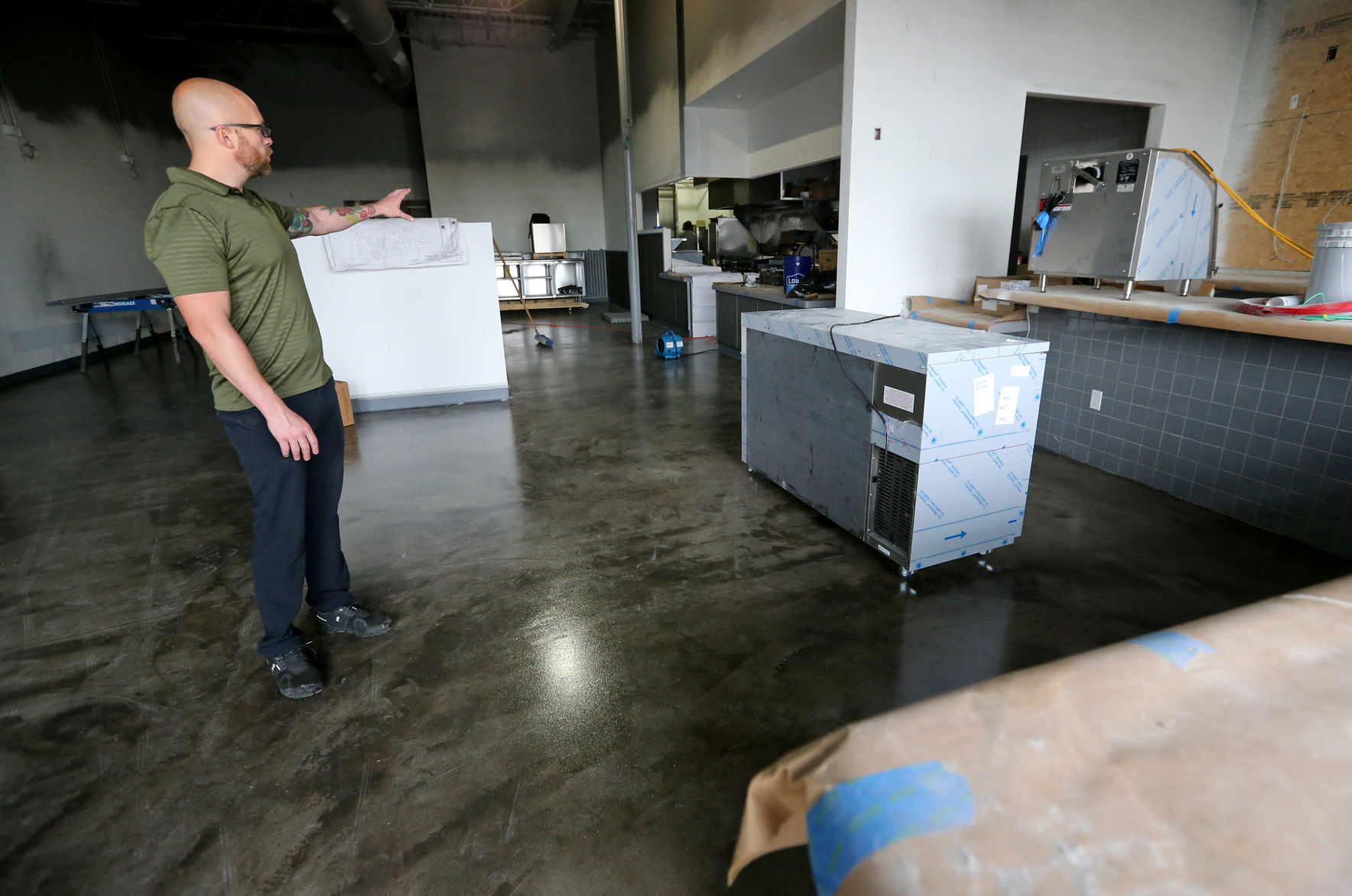 Luke Flatin, franchisee at Rusty Taco, shows off the space at 3333 Asbury Rd. in Dubuque on Monday, Sept. 13, 2021.    PHOTO CREDIT: JESSICA REILLY