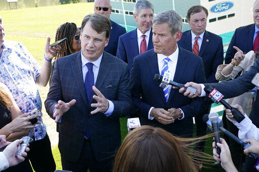 Jim Farley, Ford president and CEO, center left, along with Tennessee Gov. Bill Lee, center right, answers questions along with after a presentation on the planned factory to build electric F-Series trucks and the batteries to power future electric Ford and Lincoln vehicles Tuesday, Sept. 28, 2021, in Memphis, Tenn. The plant in Tennessee is to be built near Stanton, Tenn. (AP Photo/Mark Humphrey)    PHOTO CREDIT: Mark Humphrey