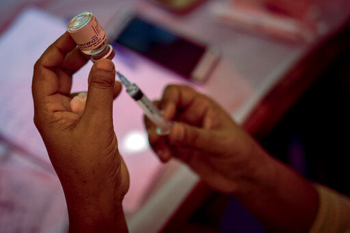 A health worker prepares to administer a dose of Covaxin during a vaccination drive against COVID-19 in New Delhi, India, Wednesday, Sept. 29, 2021. India, the world’s largest vaccine producer, will resume exports and donations of surplus coronavirus vaccines in October after halting them during a devastating surge in domestic infections in April. (AP Photo/Altaf Qadri)    PHOTO CREDIT: Altaf Qadri