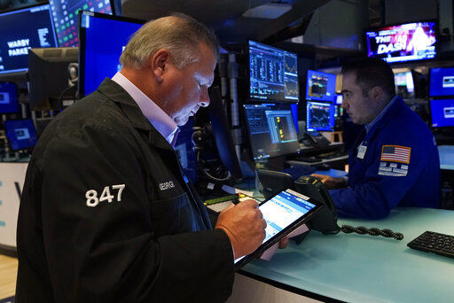 Trader George Ettinger, left, works on the floor of the New York Stock Exchange, Wednesday, Sept. 29, 2021. Stocks rose modestly in morning trading on Wall Street Wednesday as the market regains its footing following a sharp drop a day earlier. (AP Photo/Richard Drew)    PHOTO CREDIT: Richard Drew