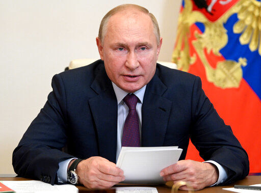 FILE - Russian President Vladimir Putin chairs a Security Council meeting via video conference at the Novo-Ogaryovo residence outside Moscow, Russia, in this Monday, Sept. 27, 2021, file photo. Hundreds of world leaders, powerful politicians, billionaires, celebrities, religious leaders and drug dealers have been stashing away their investments in mansions, exclusive beachfront property, yachts and other assets for the past quarter century, according to a review of nearly 12 million files obtained from 14 different firms located around the world. The report released Sunday, Oct. 3, 2021 by the International Consortium of Investigative Journalists involved 600 journalists from 150 media outlets in 117 countries. Russian President Vladimir Putin is one of 330 current and former politicians identified as beneficiaries of the secret accounts. (Alexei Druzhinin, Sputnik, Kremlin Pool Photo via AP, File)    PHOTO CREDIT: Alexei Druzhinin