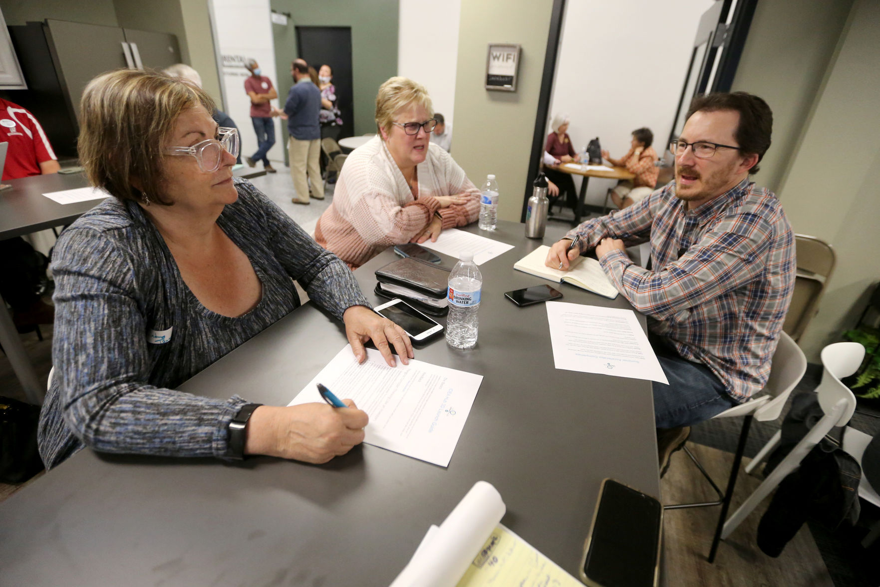 Cindy Tang (from left), Barb Clark and Ryan Del Balso discuss ideas during the grand opening of the Innovation Driving Entrepreneurship Accelerator Hub, known as the IDEA Hub, at Platteville Business Incubator in Platteville, Wis., on Monday.    PHOTO CREDIT: JESSICA REILLY