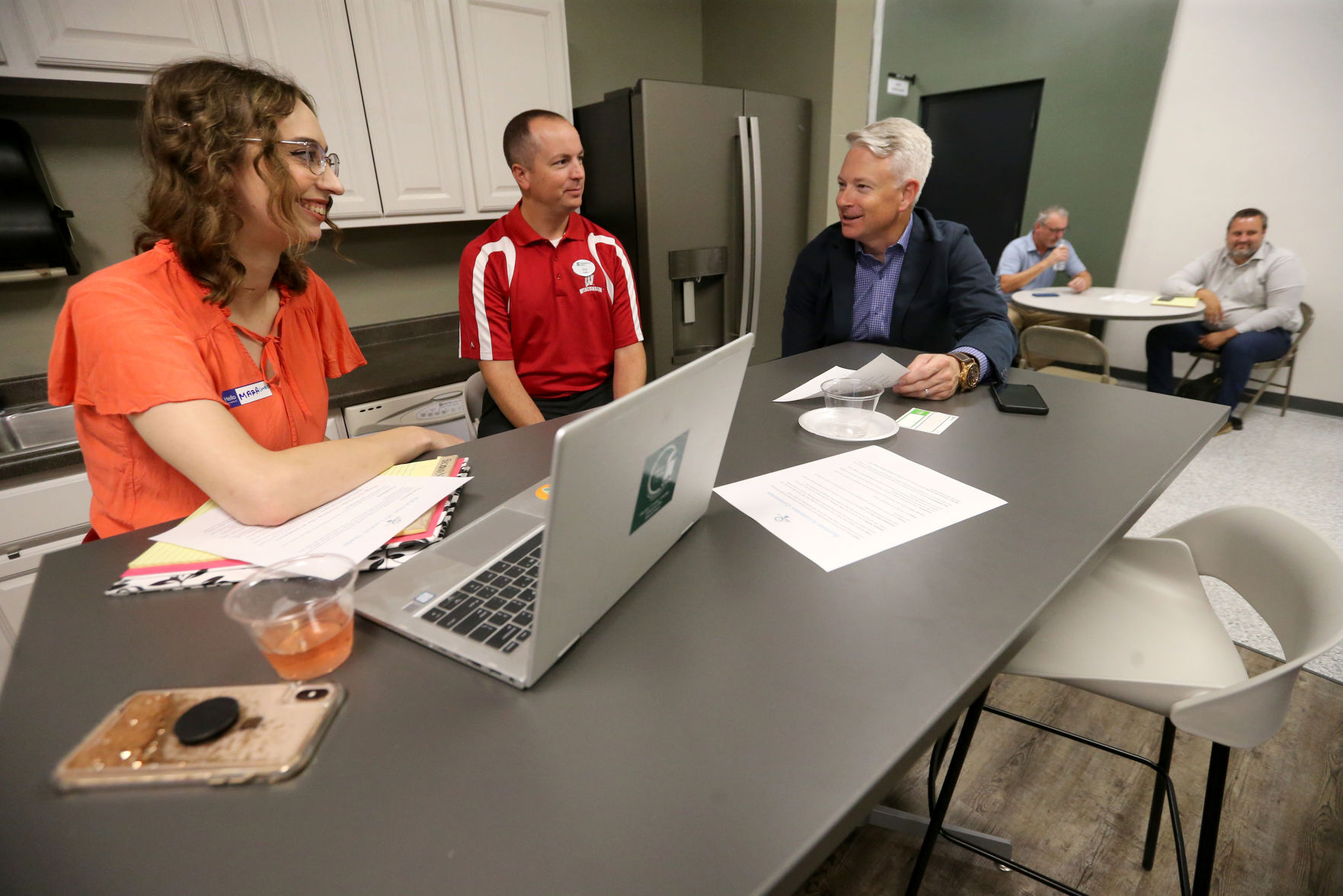 Mara Keyes (from left), Nicholas Felder and John Miller discuss ideas during the grand opening of the Innovation Driving Entrepreneurship Accelerator Hub, known as the IDEA Hub, at Platteville Business Incubator in Platteville, Wis., on Monday.    PHOTO CREDIT: JESSICA REILLY