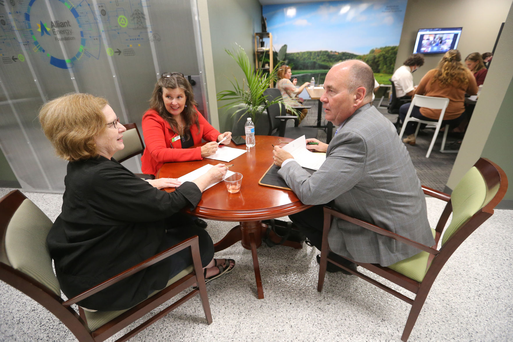 Cindy Martens (from left), Kate Koziol and George Krueger discuss ideas during the grand opening of the Innovation Driving Entrepreneurship Accelerator Hub, known as the IDEA Hub, at Platteville Business Incubator in Platteville, Wis., on Monday.    PHOTO CREDIT: JESSICA REILLY