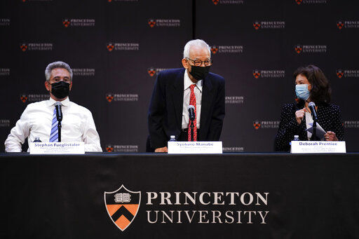 Syukuro Manabe, center, arrives for a news conference in Princeton, N.J., Tuesday, Oct. 5, 2021. Manabe and two other scientists have won the Nobel Prize for physics for work that found order in seeming disorder, helping to explain and predict complex forces of nature, including expanding our understanding of climate change. (AP Photo/Seth Wenig)    PHOTO CREDIT: Seth Wenig