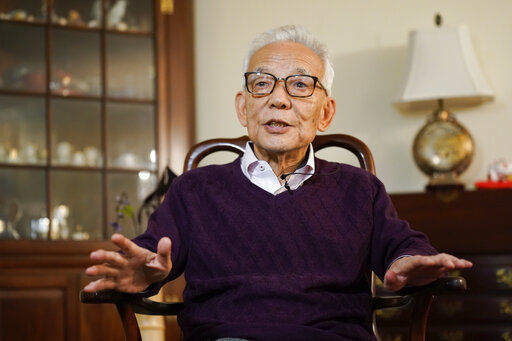 Syukuro Manabe speaks to reporters at his home in Princeton, N.J., Tuesday, Oct. 5, 2021. Manabe and two other scientists have won the Nobel Prize for physics for work that found order in seeming disorder, helping to explain and predict complex forces of nature, including expanding our understanding of climate change. (AP Photo/Seth Wenig)    PHOTO CREDIT: Seth Wenig