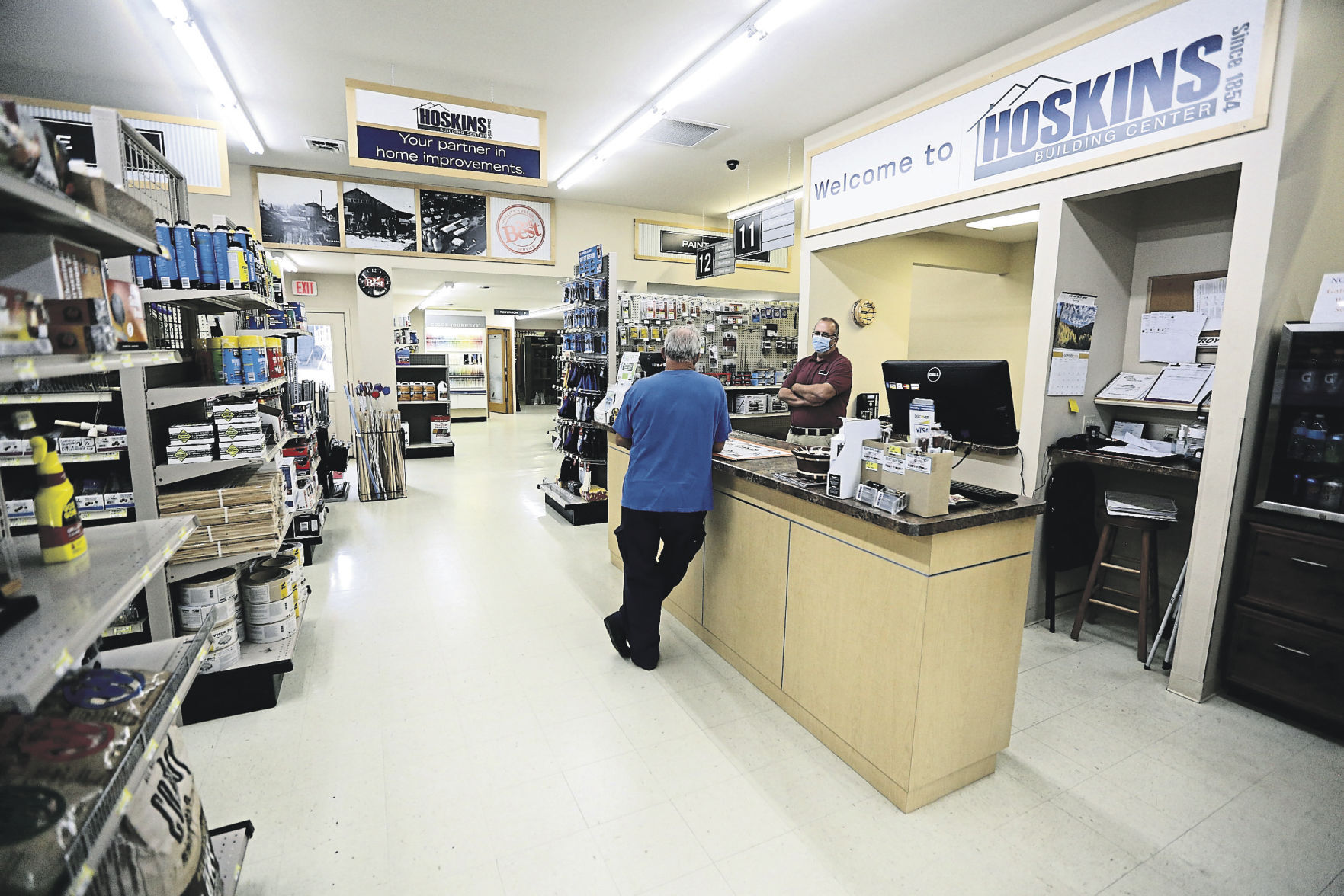 Salesman with Hoskins Building Center, Pete Korth (right) chats with a customer in the hardware store located in Elizabeth, Ill.    PHOTO CREDIT: Dave Kettering