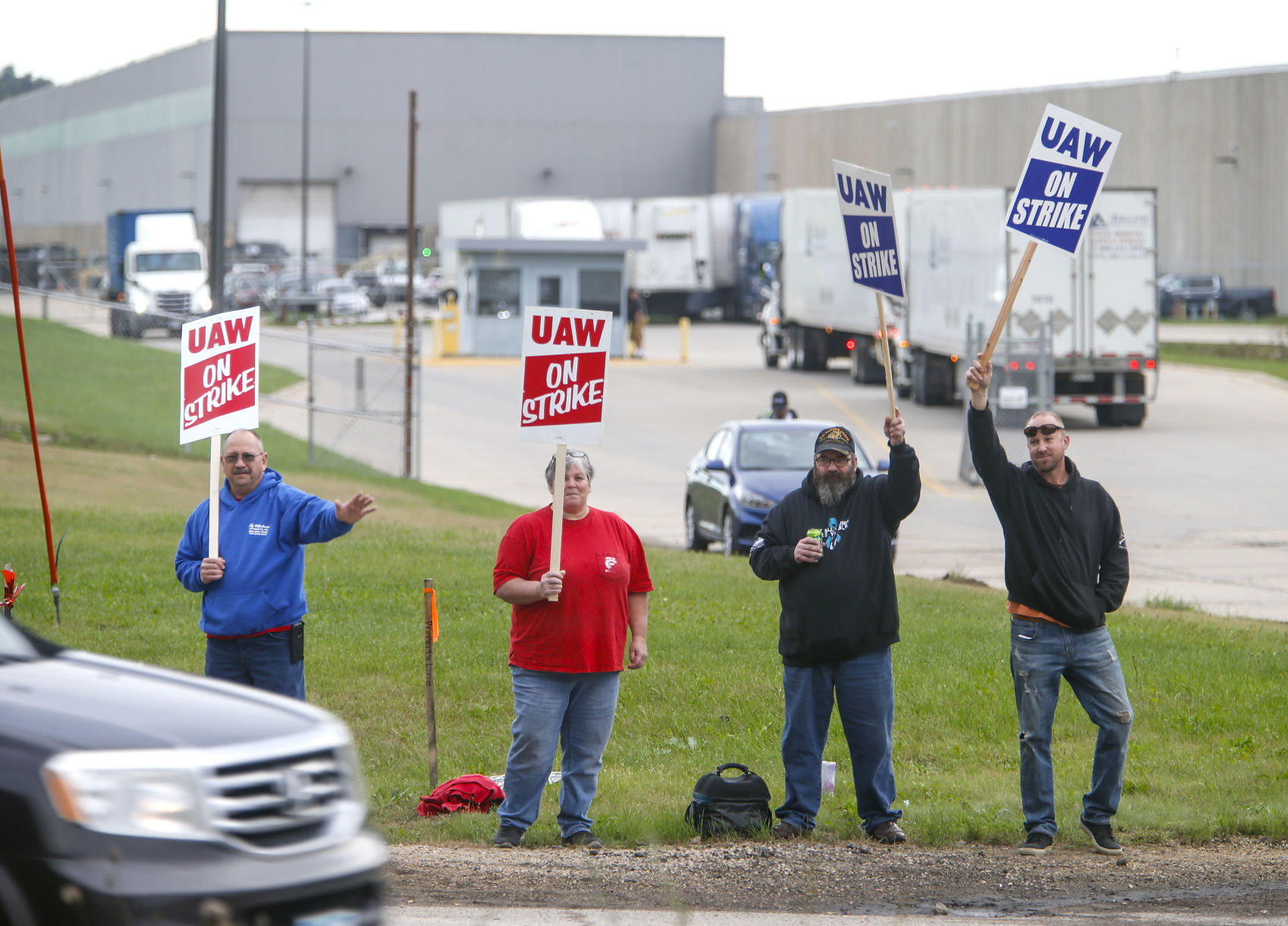 John Deere Dubuque Works union employees (from left) Rick Heid, Sheila Stirm, Kevin Hoftender and Craig Brandt picket outside the south entrance to the plant on Thursday, Oct. 14, 2021.    PHOTO CREDIT: Dave Kettering