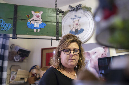 Ginger Pigg in her gift boutique The Perfect Pigg in Cumming, Ga. on Thursday afternoon, Oct. 22, 2021. She says she is struggling to get products to her store in a timely way. (AP Photo/Ben Gray)    PHOTO CREDIT: Ben Gray