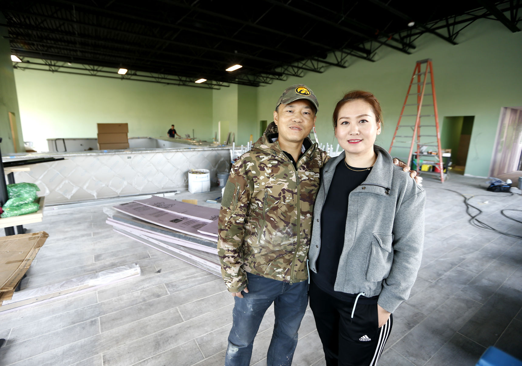 Gordon Gao and his wife, Lina Qiu, will open Lina’s Lounge on Holliday Drive in Dubuque.    PHOTO CREDIT: Dave Kettering