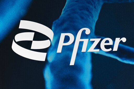 Pfizer beat third-quarter expectations and raised its 2021 forecast again even as sales of its top product, the COVID-19 vaccine Comirnaty, slipped in the U.S.     PHOTO CREDIT: Mark Lennihan