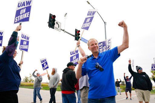 Members of the United Auto Workers strike outside of a John Deere plant, Wednesday, Oct. 20, 2021, in Ankeny, Iowa. About 10,000 UAW workers have gone on strike against John Deere since last Thursday at plants in Iowa, Illinois and Kansas. (AP Photo/Charlie Neibergall)    PHOTO CREDIT: Associated Press file