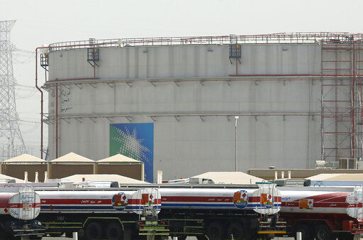 FILE - Fuel trucks line up in front of storage tanks at the North Jiddah bulk plant, an Aramco oil facility, in Jiddah, Saudi Arabia, on March 21, 2021. OPEC and allied oil-producing countries will decide on output levels Thursday Nov. 4 2021, with President Joe Biden urging alliance members Saudi Arabia and Russia to increase production and lower U.S. gasoline prices at the pump — so far to no avail. (AP Photo/Amr Nabil, File)    PHOTO CREDIT: Amr Nabil