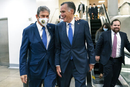 Sen. Joe Manchin, D-WVa., left and Sen. Mitt Romney, R-Utah, walk together on Capitol Hill in Washington, Thursday, Nov. 4, 2021. (AP Photo/Carolyn Kaster)    PHOTO CREDIT: Carolyn Kaster