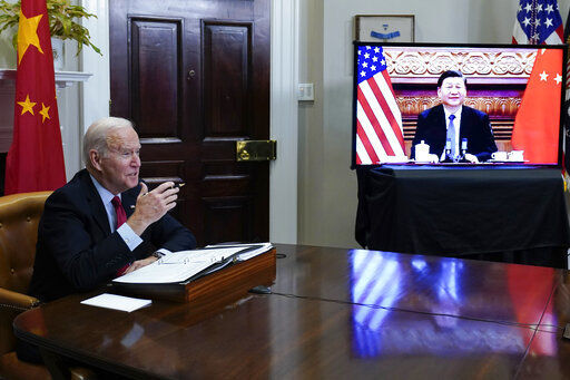 President Joe Biden meets virtually with Chinese President Xi Jinping from the Roosevelt Room of the White House in Washington, Monday, Nov. 15, 2021. (AP Photo/Susan Walsh)    PHOTO CREDIT: Susan Walsh