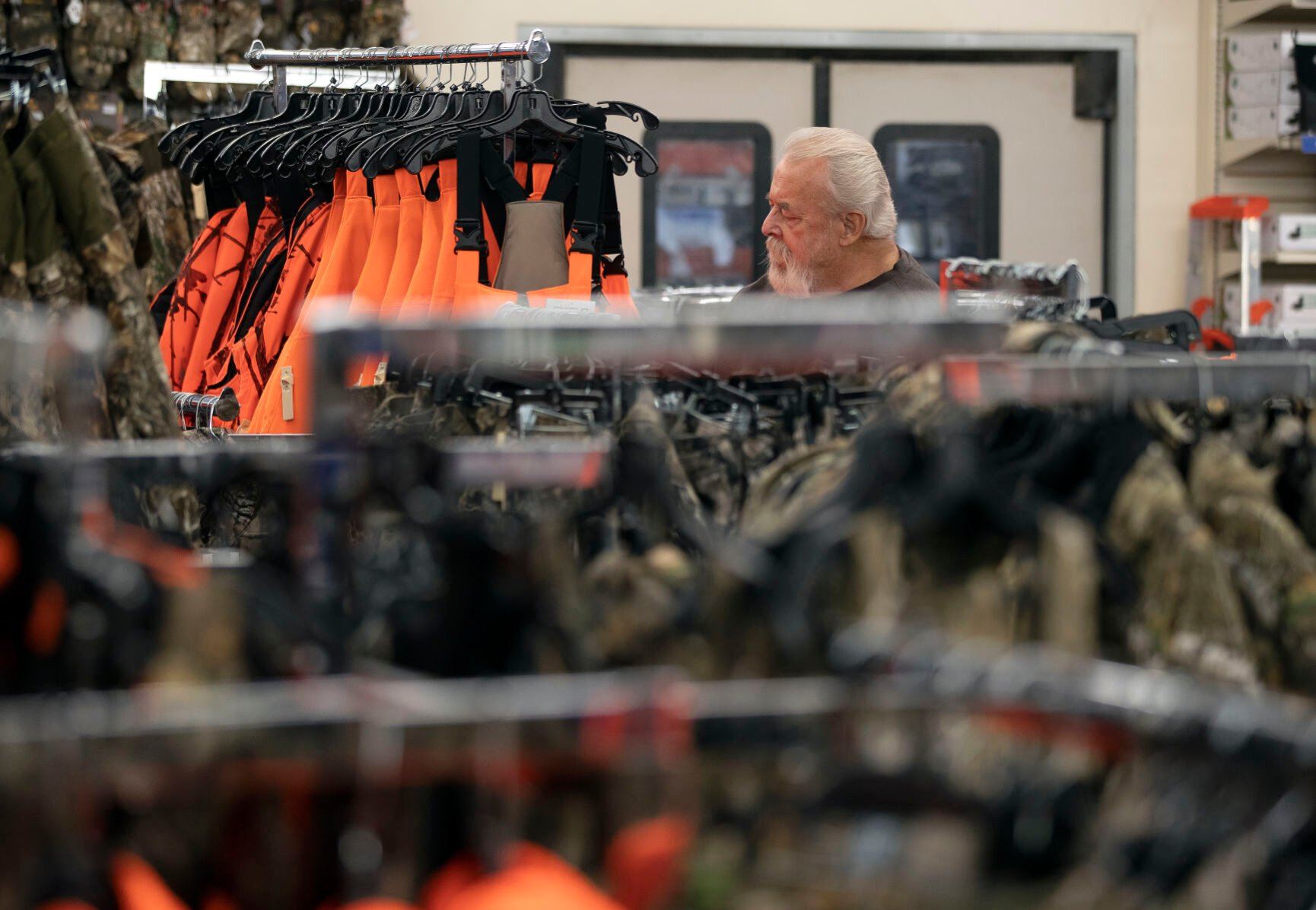 John Binninger, of East Dubuque, Ill., shops for hunting clothing at Theisen