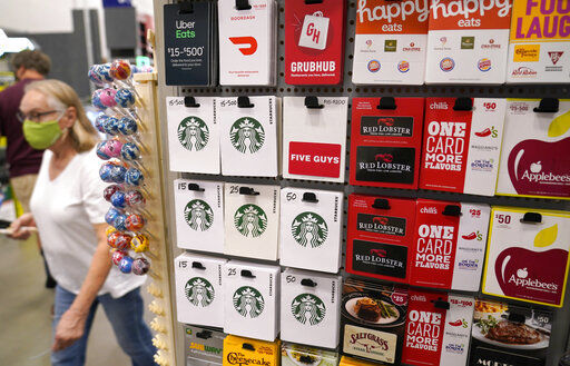 Gift cards for food and beverage businesses sit on display for sale at a retail store in Dallas. The holidays have always been defined by disappointing out-of-stock messages on the most popular items. Many shoppers will turn to more to gift cards if they don