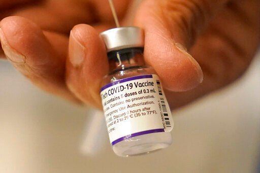 Pfizer said today that a booster dose of its COVID-19 vaccine may protect against the new omicron variant even though the initial two doses appear significantly less effective.    PHOTO CREDIT: Steven Senne