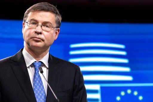 EU Trade Commissioner Valdis Dombrovskis speaks during a press conference after the Economic and Financial Affairs Council meeting at the Europa building in Brussels, on Dec. 7, 2021. The European Union wants to set up a system of trade sanctions that it could impose on any foreign power it accuses of trying to coerce the 27-country bloc for economic or political gain. The EU’s executive branch, the European Commission, wants to be able to react without needing the endorsement of all member nations when a person, company or country tries to strong-arm the bloc. It says such a plan could be used in situations like China’s diplomatic and trade spat with Lithuania over Taiwan.    PHOTO CREDIT: Olivier Matthys