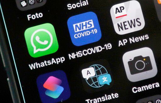 A new report group says digital contact tracing apps, artificial intelligence and other tech tools that governments rolled out to combat COVID-19 failed to play a key role in solving the pandemic and now threaten to make such monitoring widely accepted.     PHOTO CREDIT: Frank Augstein