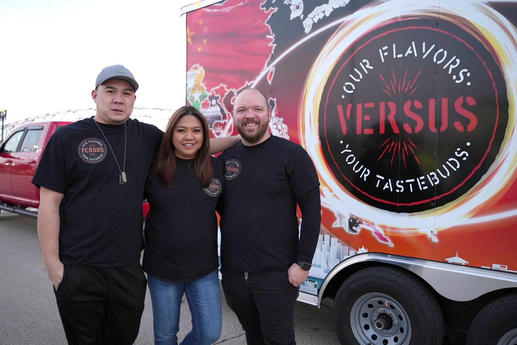 Owners Ken Giang (from left), Liberty Miller and Lucas Miller stand in front of the Versus food truck in Dubuque.    PHOTO CREDIT: PAUL KURUTSIDES